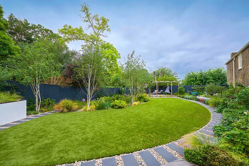 Established garden with lawn, trees and planted borders